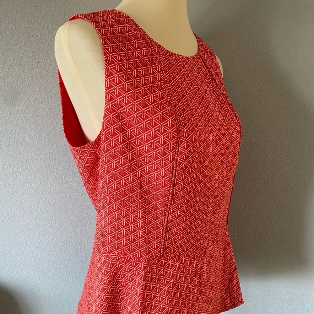 Geometric peplum hem fitted blouse tank